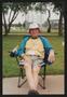Photograph: [Man smiling in a lawn chair: Lone Star Ride 2004 event photo]