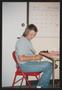 Photograph: [Individual sitting in a red fold-out chair: Lone Star Ride 2004 even…