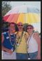 Photograph: [Rainbow umbrella volunteers: Lone Star Ride 2004 event photo]