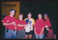 Photograph: [Volunteers in red LSR shirts: Lone Star Ride 2004 event photo]