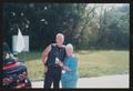 Photograph: [Two volunteers smiling by a motorcycle: Lone Star Ride 2004 event ph…