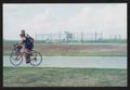 Photograph: [Two cyclists riding next to each other on a rural road: Lone Star Ri…