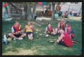 Photograph: [Cyclists sitting on the grass: Lone Star Ride 2004 event photo]