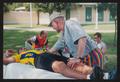 Photograph: [Man on his back getting a massage: Lone Star Ride 2004 event photo]