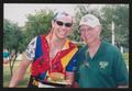 Primary view of [Cyclist and a man in a Dallas Stars polo: Lone Star Ride 2004 event photo]