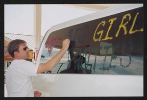 Primary view of object titled '[Big girl panties van getting gas: Lone Star Ride 2004 event photo]'.