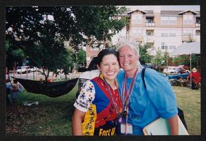 Primary view of object titled '[Janie Bush and young cyclist hugging: Lone Star Ride 2004 event photo]'.