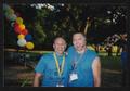 Thumbnail image of item number 1 in: '[Two volunteers in blue T-shirts: Lone Star Ride 2004 event photo]'.
