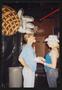 Photograph: [A man and women laughing over pie: Lone Star Ride 2001 event photo]