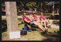 Photograph: [Three crew members seated in lawn chairs: Lone Star Ride 2001 event …