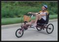 Primary view of [Man in a blue helmet riding a recumbent bike: Lone Star Ride event photo]