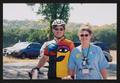Primary view of [Cyclist and a crew member posing together: Lone Star Ride 2005 event photo]
