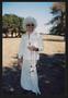 Primary view of [Volunteer in an all white disco costume: Lone Star Ride event photo]