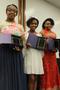 Photograph: [Wrayne Simmons, Carrigan Smith and girl receive awards at Congo Stre…