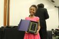Photograph: [Niyah Murphy receives award at Congo Street ceremony]
