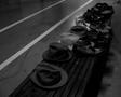 Photograph: [Hats and shoes on a bench]