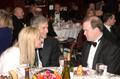 Thumbnail image of item number 1 in: '[Sharon Stone converses with men at 2005 Black Tie Dinner]'.