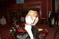Photograph: [Sharon Stone and Cynthia Barbare kiss on a motorcycle, 2005 Black Ti…