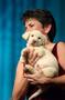 Photograph: [Kathy Hewitt holds puppy during live auction, 2005 Black Tie Dinner]