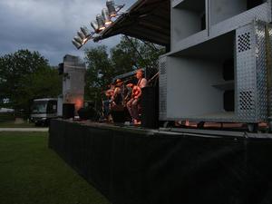 Primary view of object titled '[Terry Rasor, Butch Hancock, and Steven Fromholz on stage at John A. Lomax Texas Music Gathering]'.