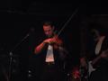 Photograph: [Man plays violin at Vicky G. Moerbe tribute concert]