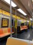 Primary view of [New York City subway train interior and public service face mask posters]