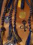 Photograph: [Golden Key Honor Society graduation stool. medals, and tassels]