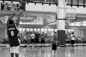 Primary view of object titled '[Sirik Hearn takes shot during intramural three-point contest, 1]'.