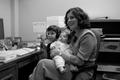 Thumbnail image of item number 1 in: '[Concha Neeley with her children in UNT office]'.