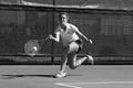 Photograph: [Lynley Wasson hits forehand during Stephen F. Austin match, 1]