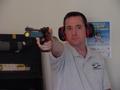 Photograph: [Steve Swartz poses with air pistol, 4]