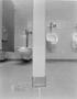 Photograph: [Urinals and a toilet in a bathroom]