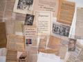 Photograph: Closeup of a collection of assorted clippings and loose pages