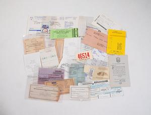 A variety of scattered invoices, receipts, and tickets.