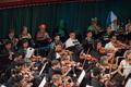 Thumbnail image of item number 1 in: '[Close-up of violinists and brass instrument musicians performing at the Spooktacular Performance]'.