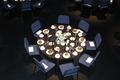 Photograph: [Aerial view of a round reception table at the Jake Heggie camerata r…