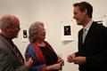 Photograph: [Heggie conversing with two people at the Jake Heggie post-concert re…