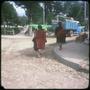 Photograph: [Two people walking towards a truck in Tarabucu]