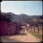 Photograph: [People walking in a Florianopolis slum]