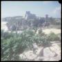 Photograph: [A distant view of a portion of the Tulum ruins]