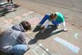 Photograph: [Students create sidewalk chalk drawings]