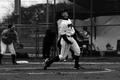Photograph: [Kelei Walker throws ball during softball game, 2]