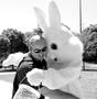 Photograph: [Man poses with Easter Bunny]