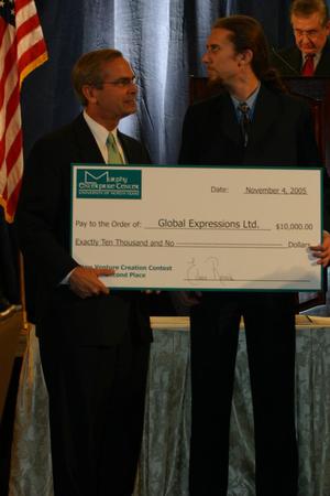 Primary view of object titled '[Daniel Strebe receives $10,000 award at Leadership Luncheon]'.