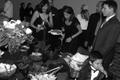 Photograph: [Attendees arrange food at Posh Picnic]