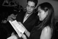 Photograph: [Man and woman read program at Posh Picnic]