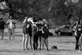 Photograph: [UNT men's track team huddles at 28th North Texas Invitational]