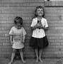 Thumbnail image of item number 1 in: '[Two children standing in front of a brick wall #8]'.