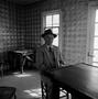Photograph: [An elderly man sitting at a table #1]