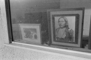 Primary view of object titled '[Two framed photographs in a window]'.